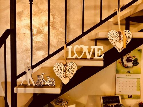 a room with hearts hanging on the stairs at Villa La Baia a pochi passi dal lago in San Felice del Benaco
