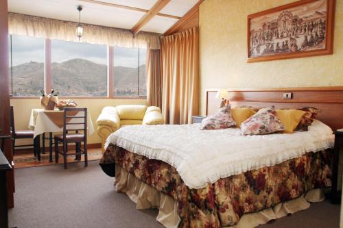 Hotel El Puma tesisinde bir odada yatak veya yataklar