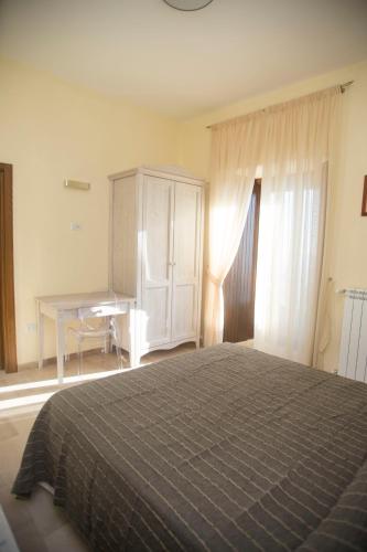 Postel nebo postele na pokoji v ubytování L'Antico Monastero