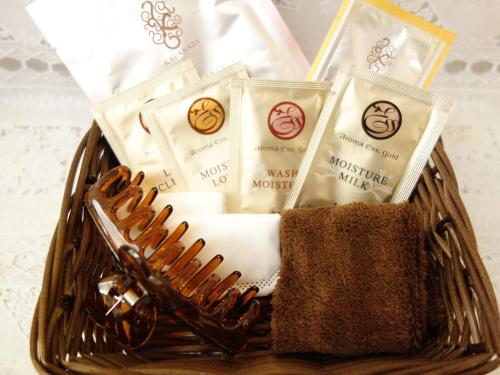 a basket filled with towels and a baseball glove at Hotel Coco Grand Kitasenju in Tokyo