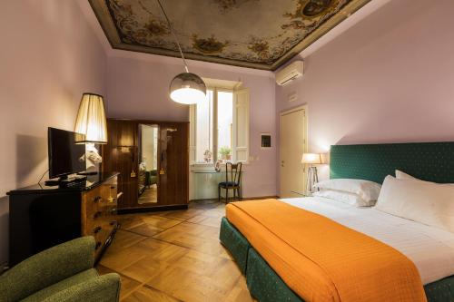 Postel nebo postele na pokoji v ubytování Hotel la Scala