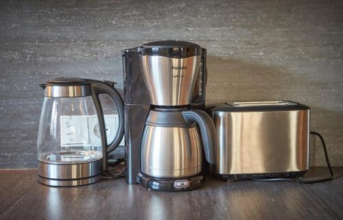 a blender sitting on a table next to a container at Chalet Guter Hirte in Saalbach Hinterglemm