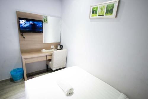 Postel nebo postele na pokoji v ubytování Hotel 99 Kota Kemuning