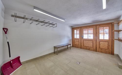 a room with a table and a bench on a wall at Chalet Guter Hirte in Saalbach Hinterglemm