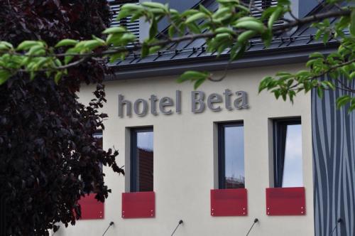 a hotel sign on the side of a building at Hotel Beta in Bzenec
