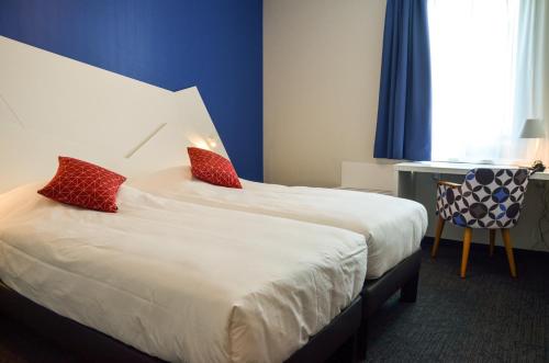 Cama o camas de una habitación en Hôtel ORIGAMI