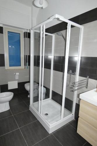 a bathroom with a shower and a toilet at B&B enjoy music in Villa San Giovanni