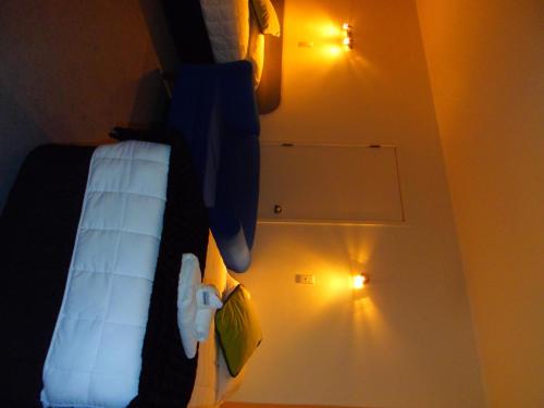 a hotel room with a bed with stuffed animals on it at Kapiti Lindale Motel and Conference Centre in Paraparaumu