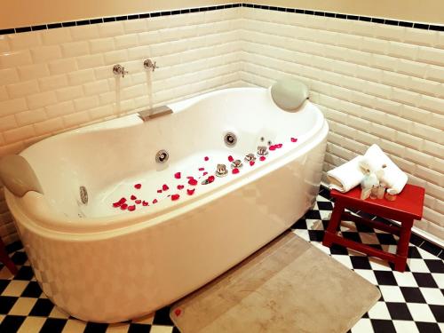 a bath tub with hearts on it in a bathroom at Royal St. Andrews Hotel, Spa and Conference Centre in Port Alfred
