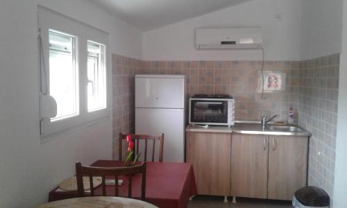Kuchyň nebo kuchyňský kout v ubytování Danijela Apartmani