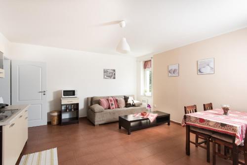 a living room with a couch and a table at Ubytování Vila Sobotka in Sobotka