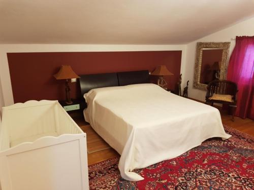 Un pat sau paturi într-o cameră la Country House Resort Villa Giardino degli Eventi