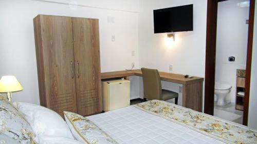 Postel nebo postele na pokoji v ubytování Schenkel Hotel
