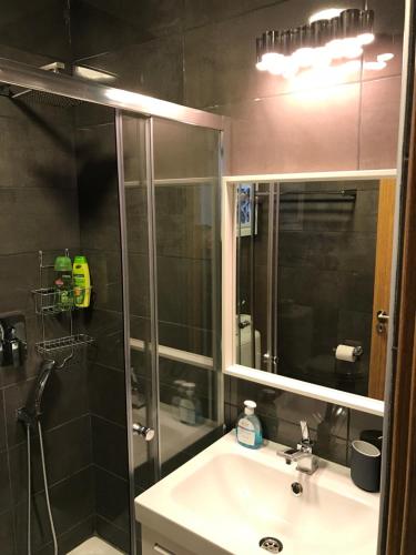 a bathroom with a shower and a sink and a mirror at Luxury Studio Ayia Napa Center in Ayia Napa