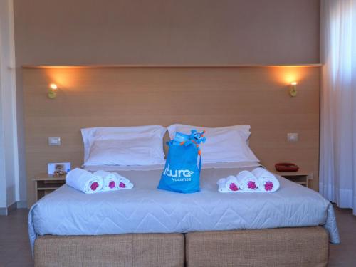 A bed or beds in a room at Futura Club Casarossa
