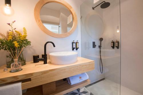 a bathroom with a sink and a shower at Herdade Do Touril in Zambujeira do Mar