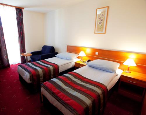 Кровать или кровати в номере Hotel Creina