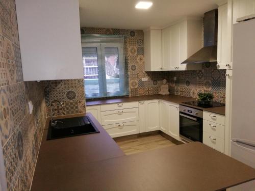 Kuchyň nebo kuchyňský kout v ubytování Apartamento Vintage Benidorm
