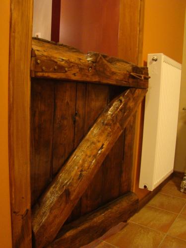 a wooden door in the corner of a room at Guest house Western-city in Chaudfontaine