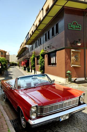 a red car parked in front of a building at Armada Istanbul Old City Hotel in Istanbul