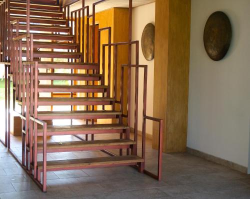 a set of wooden stairs in a room at Balian Prana in Selemadeg