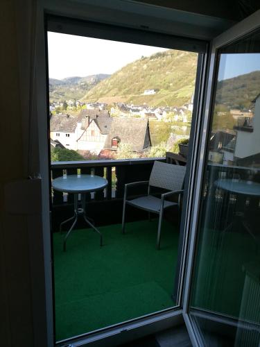 a view of a balcony with a table and chairs at Gästehaus Spies in Bullay