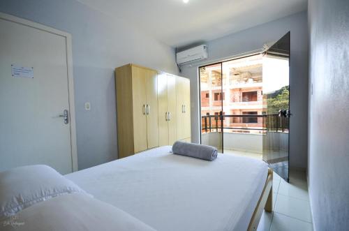 A bed or beds in a room at Residencial San Jorge