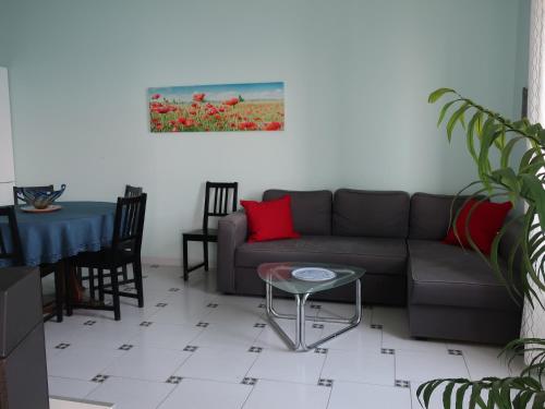 a living room with a couch and a table at Turchese in Amalfi