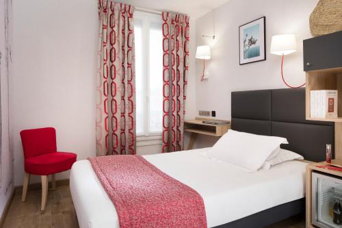 Postel nebo postele na pokoji v ubytování Hotel Daumesnil-Vincennes