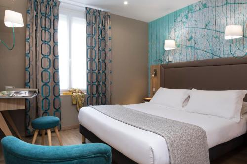Postel nebo postele na pokoji v ubytování Hotel Daumesnil-Vincennes
