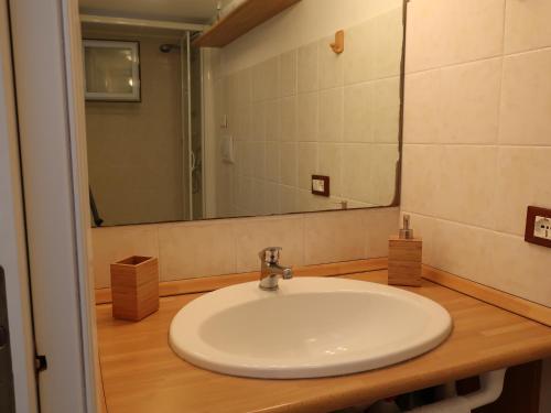 a bathroom with a white sink and a mirror at Turchese in Amalfi