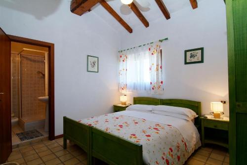 Ένα ή περισσότερα κρεβάτια σε δωμάτιο στο Agriturismo Il Portico
