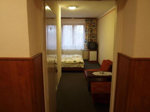 A bed or beds in a room at Árnyas Thermal Camping és Üdülőpark