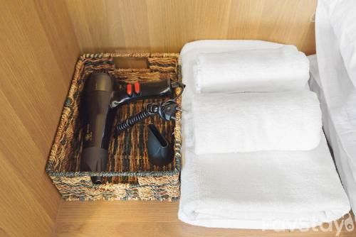 a wooden drawer with a knife and a cutting board at Rain Cha-am Huahin By Sake in Cha Am