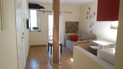 a living room with a couch and a table at Mundaka Sea Apartment in Mundaka