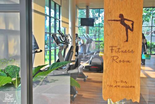 a gym with a sign that reads trimester renew at Rain Cha-am Huahin By Sake in Cha Am