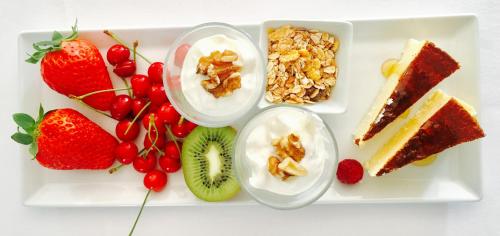 a white plate with different types of food on it at Finca Cas Sant in Sóller