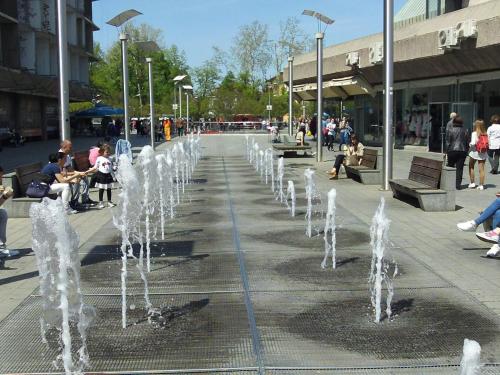 a row of water fountains on a city street at Stan na dan Banja Luka in Banja Luka