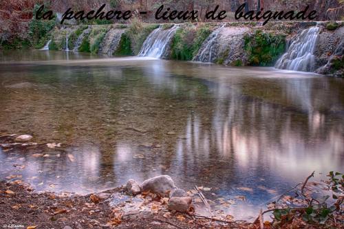 a waterfall in a river with the words a paradise must be paradise at Chez Annie in Tuchan
