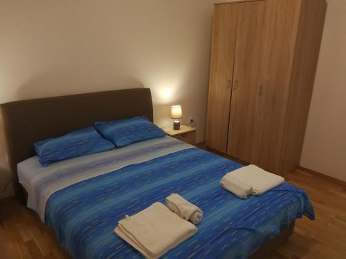 Кровать или кровати в номере Apartment Misulino