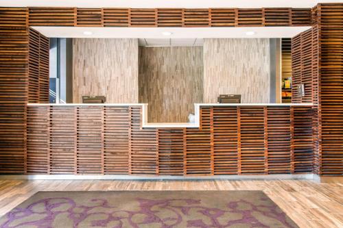an office lobby with wooden walls and desks at Comfort Inn Largo-Washington DC East in Upper Marlboro
