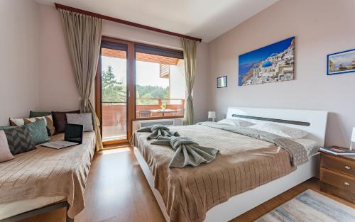 Ліжко або ліжка в номері Veli Hills Apartments