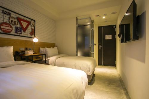 TV a/nebo společenská místnost v ubytování Re-Change Hotel Taipei