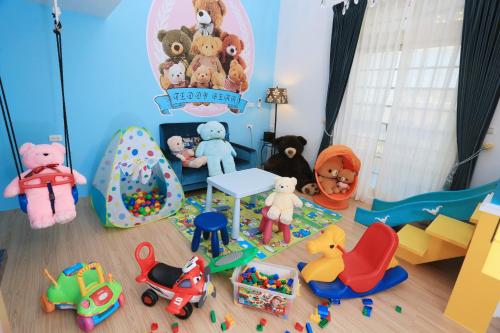 a toy room with many different toys on the floor at An Ti Li Ya Homestay in Dongshan
