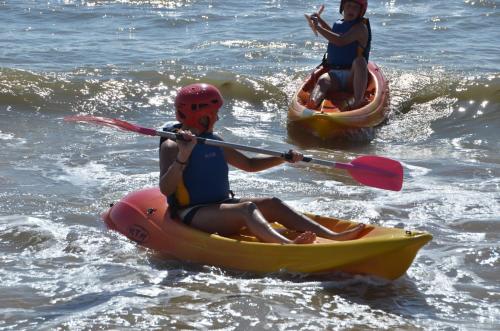 two people in kayaks in the water at Camping Le Lagon Bleu in Notre-Dame-de-Monts