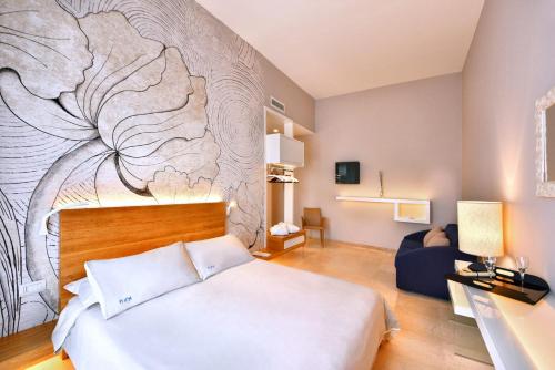 เตียงในห้องที่ Hotel d'Altavilla