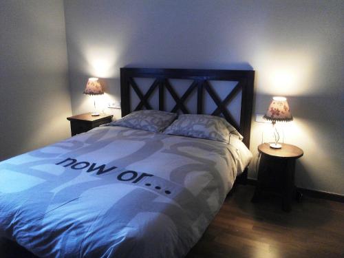 Un pat sau paturi într-o cameră la Le petit Espot