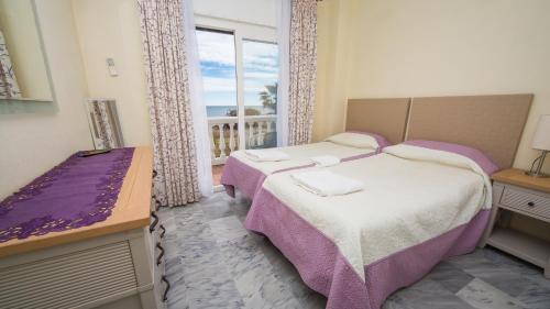 Postel nebo postele na pokoji v ubytování Aldea Beach 152