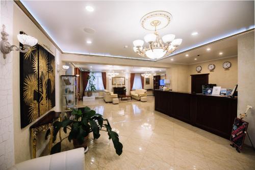 a lobby with a reception desk and a waiting room at Premier Hotel in Smolensk