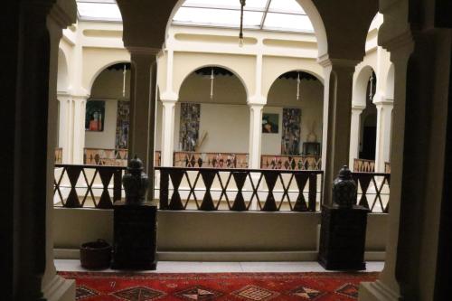 a hallway of a building with a balcony at Al Koot Heritage Hotel in Al Hofuf